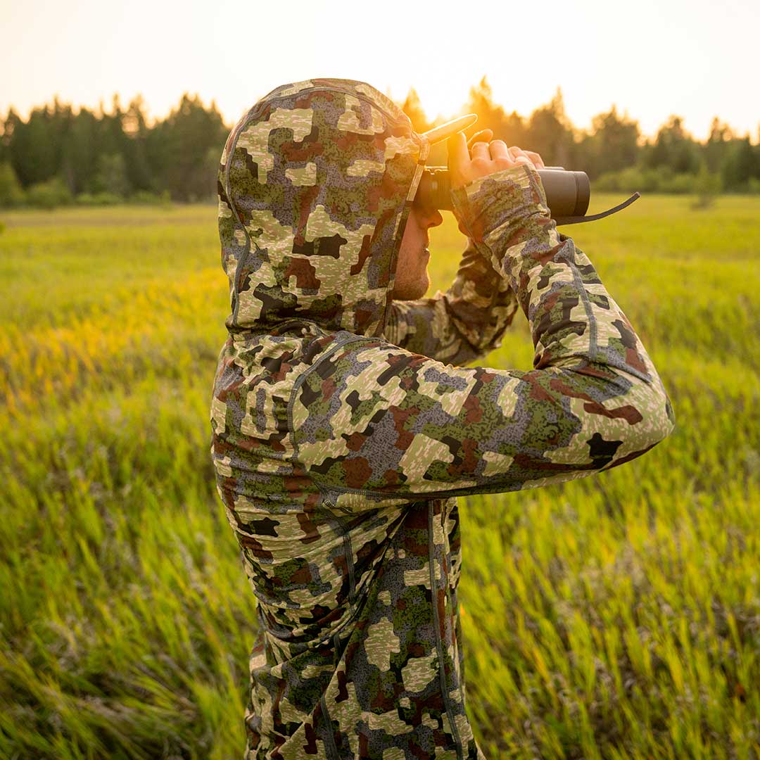 Hunter wearing camouflage Insect Shield® SolAir Hooded Long Sleeve Shirt - FORLOH